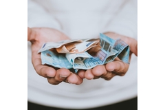 Image Person holding euros in their hands.